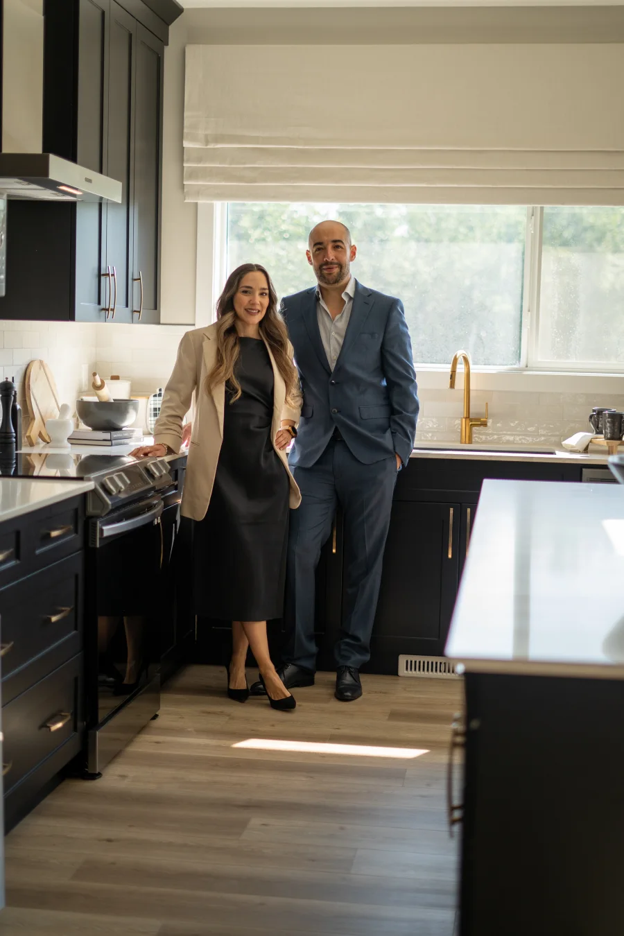 Lore and Enrique together in a home kitchen